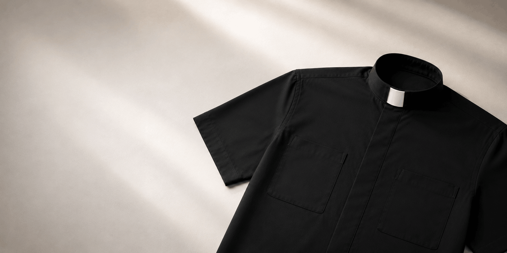 Black clergy shirt with white collar